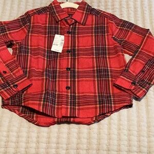 Place Red and Green Plaid Shirt by children place just in time for Christmas.